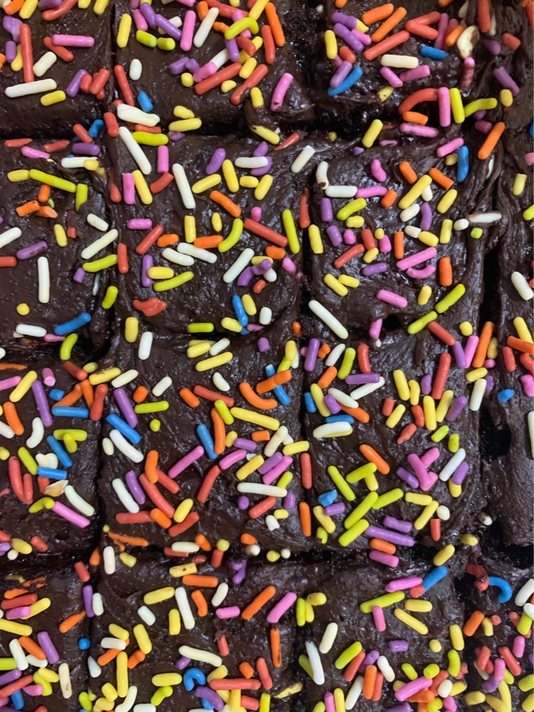 Rich chocolate fudge cake with rainbow sprinkles